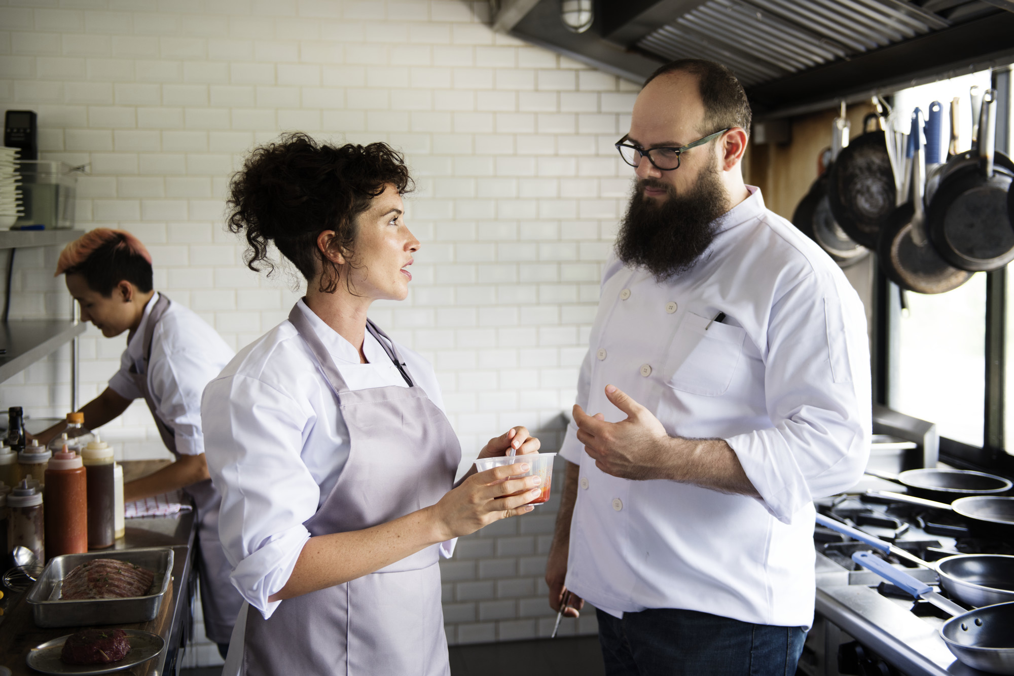 chef coaching team during service